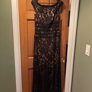 Black lace long dress with stretchy light gold lining. Size 14. Worn once.